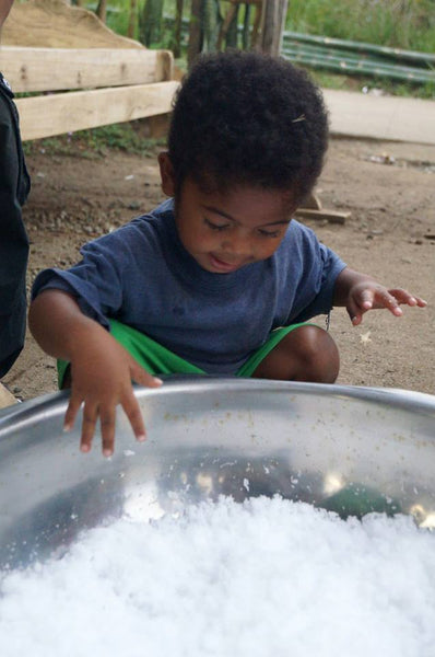 Aeta child of the Philippines experiencing snow for the first time.
